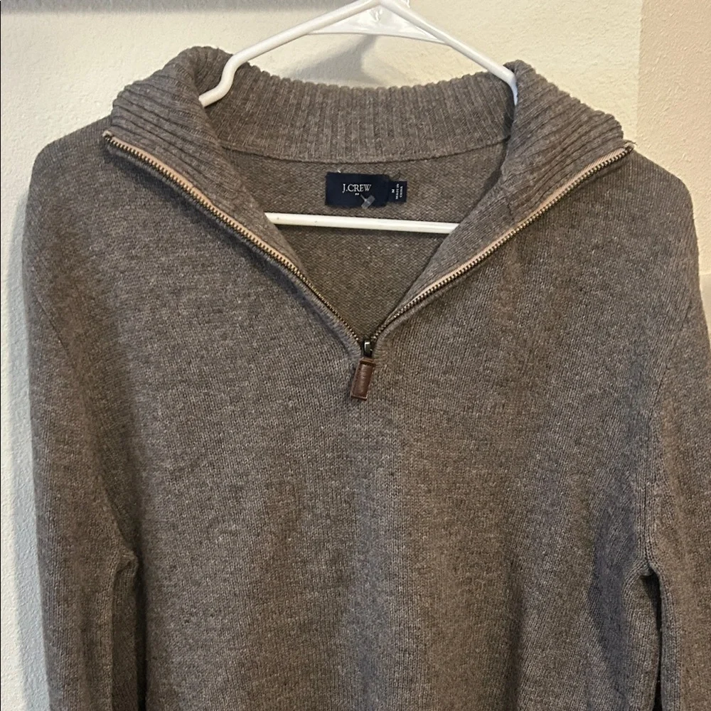 JCrew 100% Lambswool Sweater with a 1/4 zip at the neck.